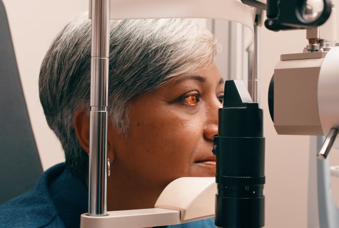 Person undergoing an eye examination at clinic.