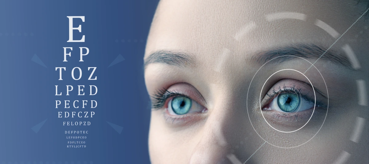 Close-up of blue eyes with eye chart.
