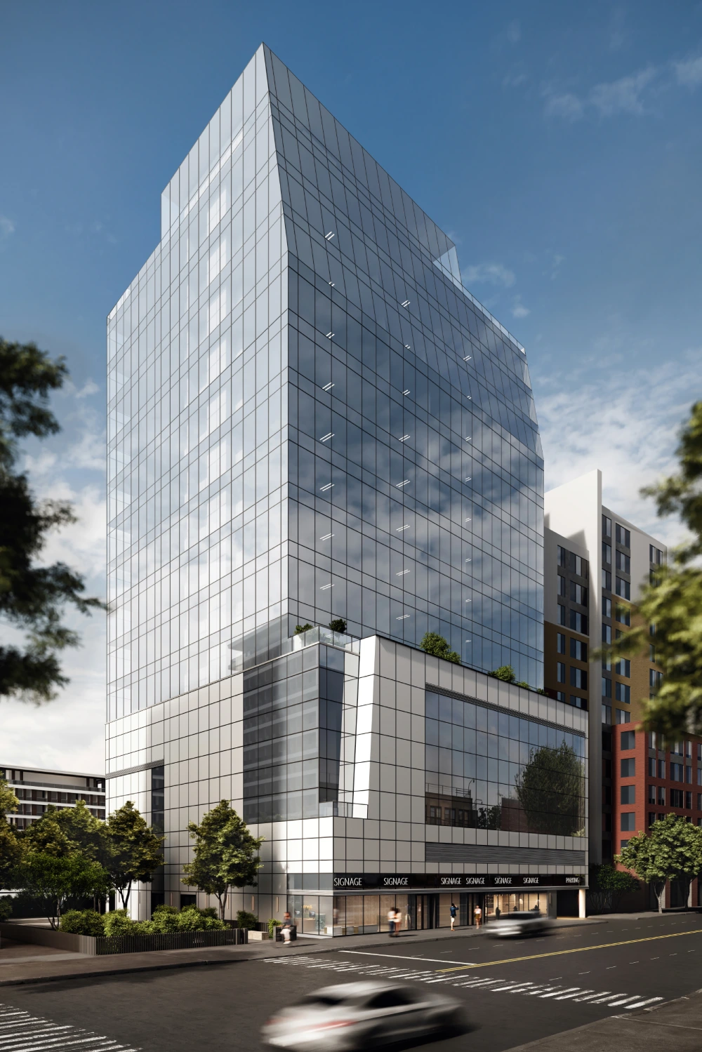 Modern glass office building on city street.